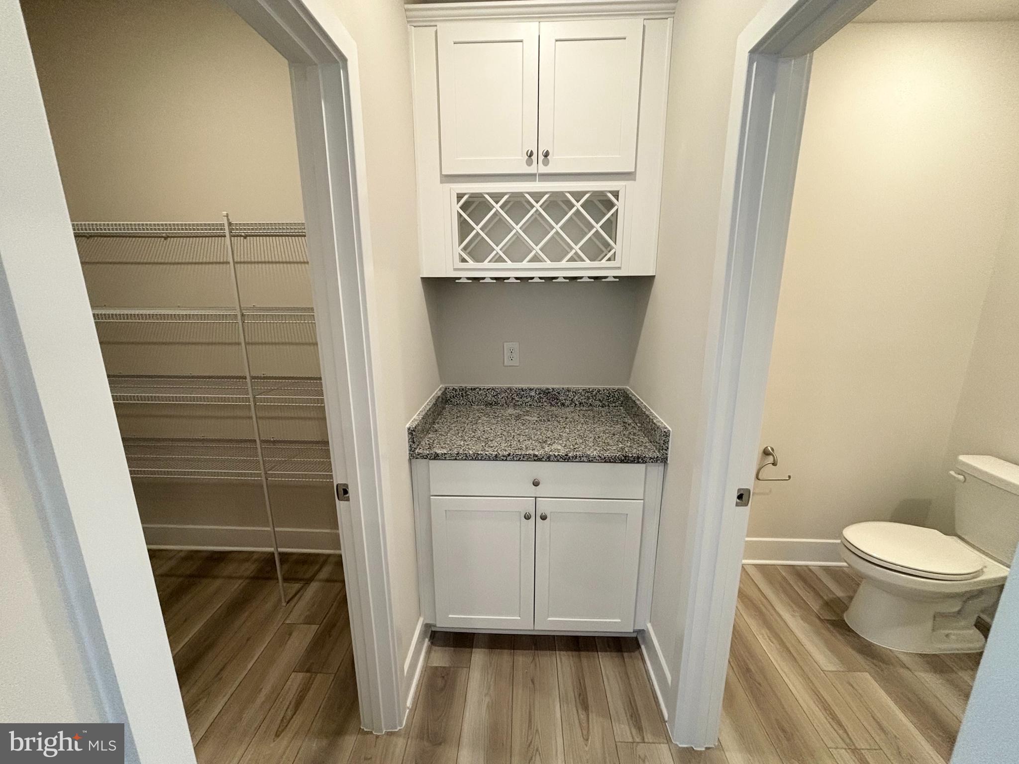 7260 Contee Road Laurel, MD 20707 - Photo 4 of 13 a bathroom with a granite countertop sink toilet and shower