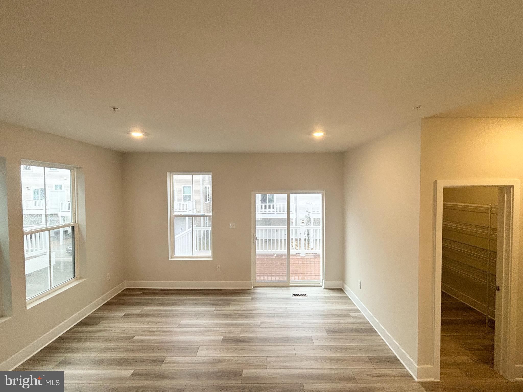 7260 Contee Road Laurel, MD 20707 - Photo 5 of 13 a view of an empty room with wooden floor and a window