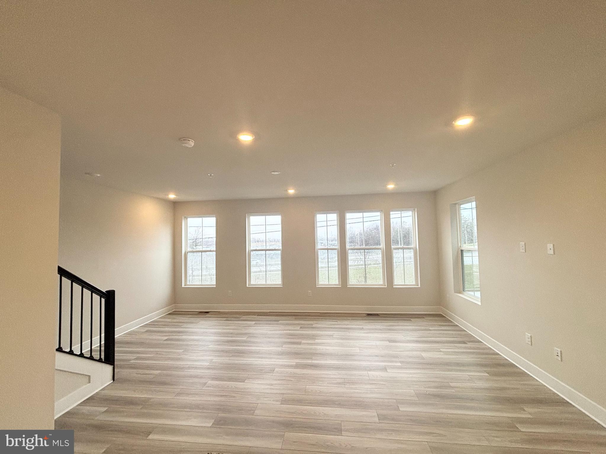 7260 Contee Road Laurel, MD 20707 - Photo 6 of 13 a view of an empty room with wooden floor and a window
