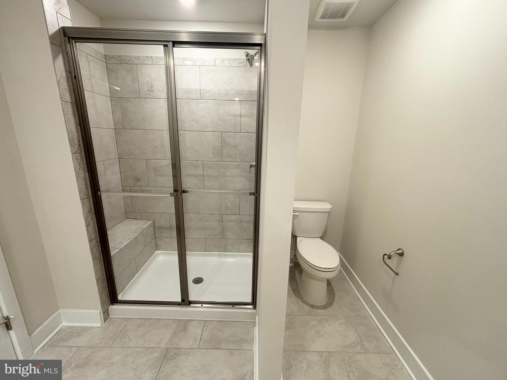 7260 Contee Road Laurel, MD 20707 - Photo 9 of 13 a bathroom with a toilet and a shower