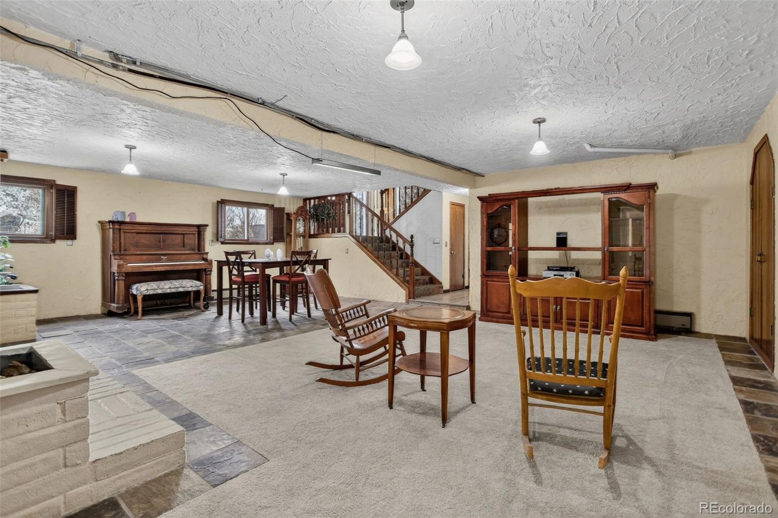 12699 South Foxton Road Conifer, CO 80433 - Photo 11 of 40 a livingroom with furniture and a flat screen tv