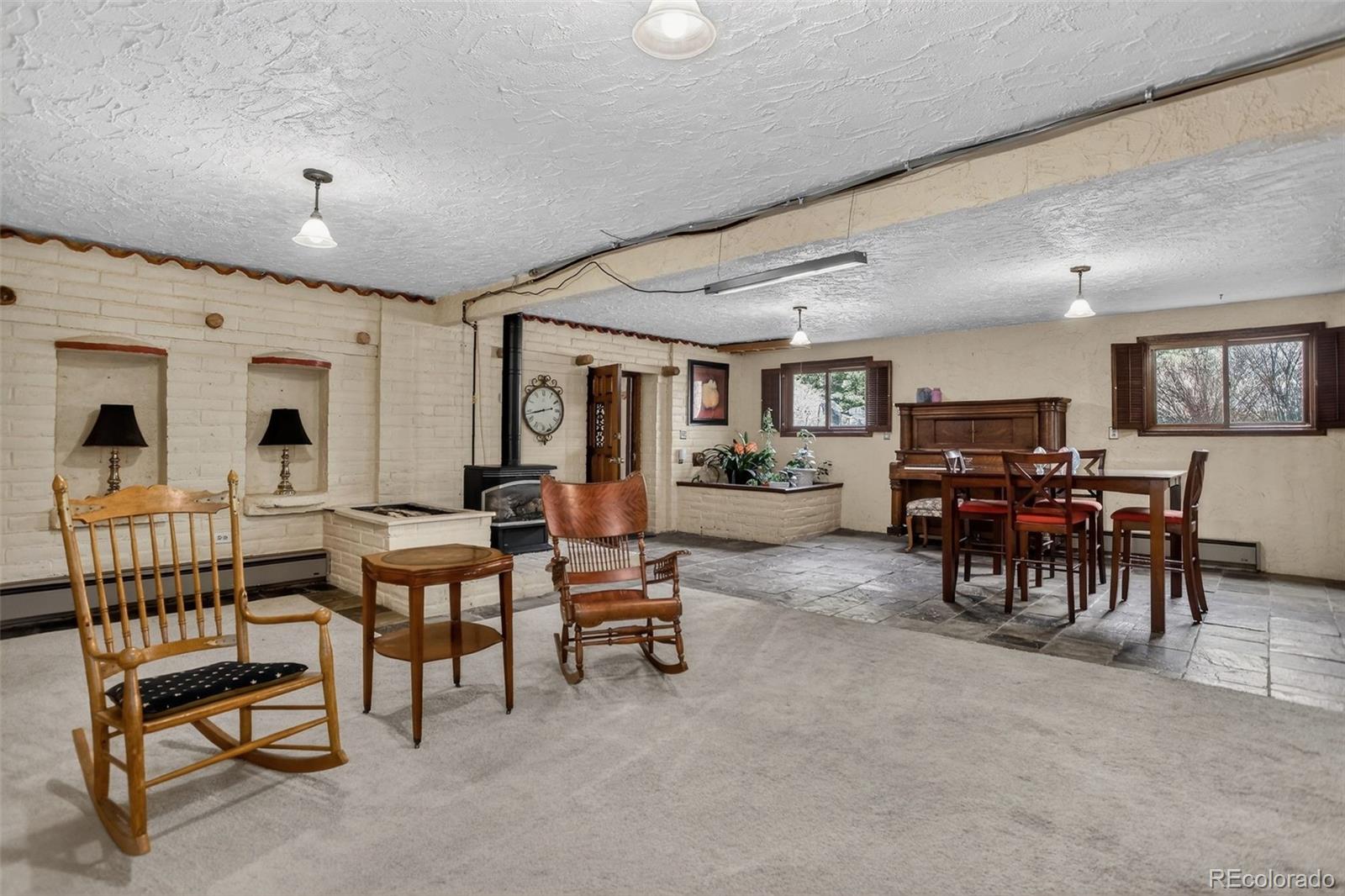 12699 South Foxton Road Conifer, CO 80433 - Photo 12 of 40 a view of a livingroom with furniture and a dining table
