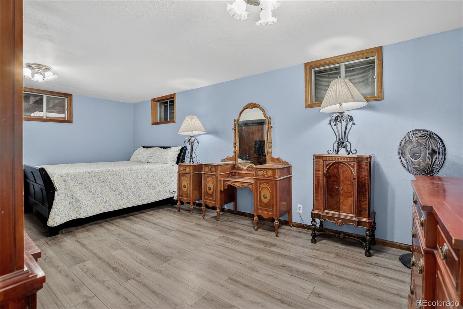 12699 South Foxton Road Conifer, CO 80433 - Photo 23 of 40 a bedroom with furniture and a window
