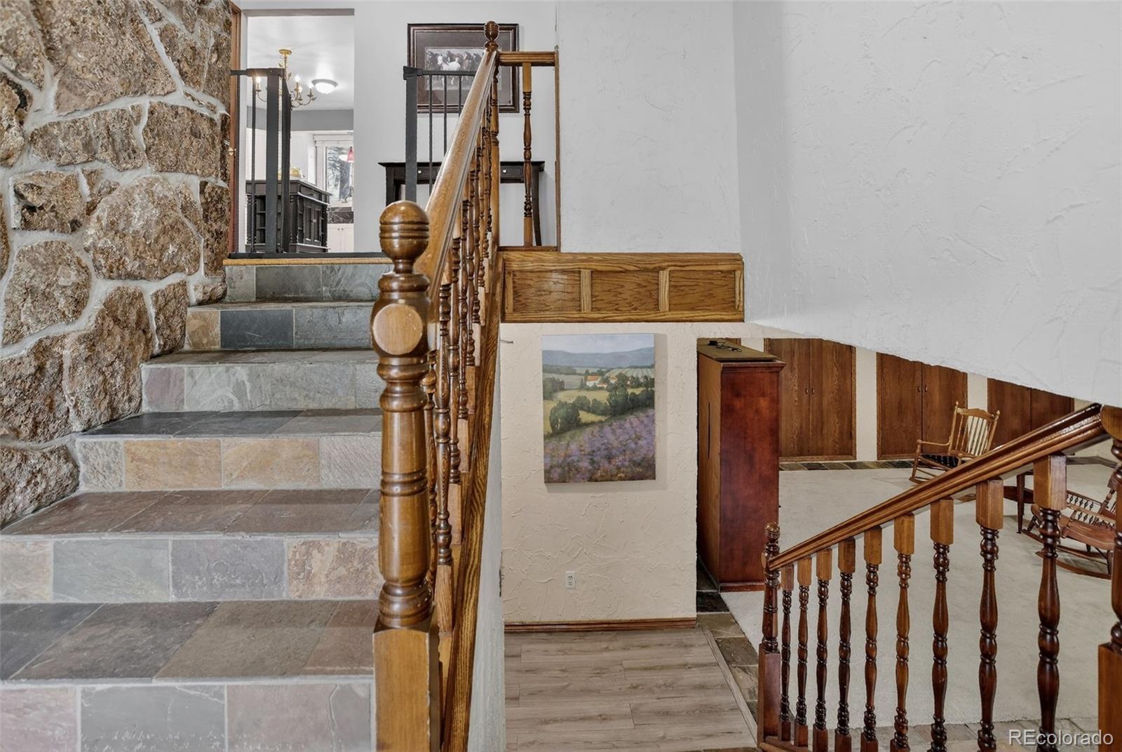 12699 South Foxton Road Conifer, CO 80433 - Photo 27 of 40 a view of entryway and hall with wooden floor