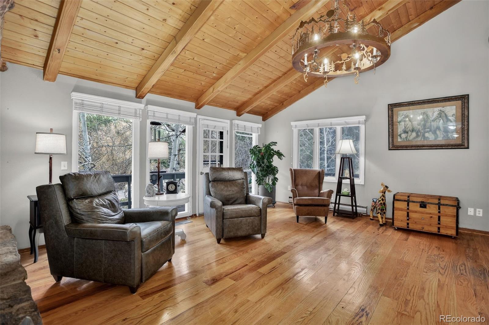 12699 South Foxton Road Conifer, CO 80433 - Photo 3 of 40 a living room with furniture and wooden floor