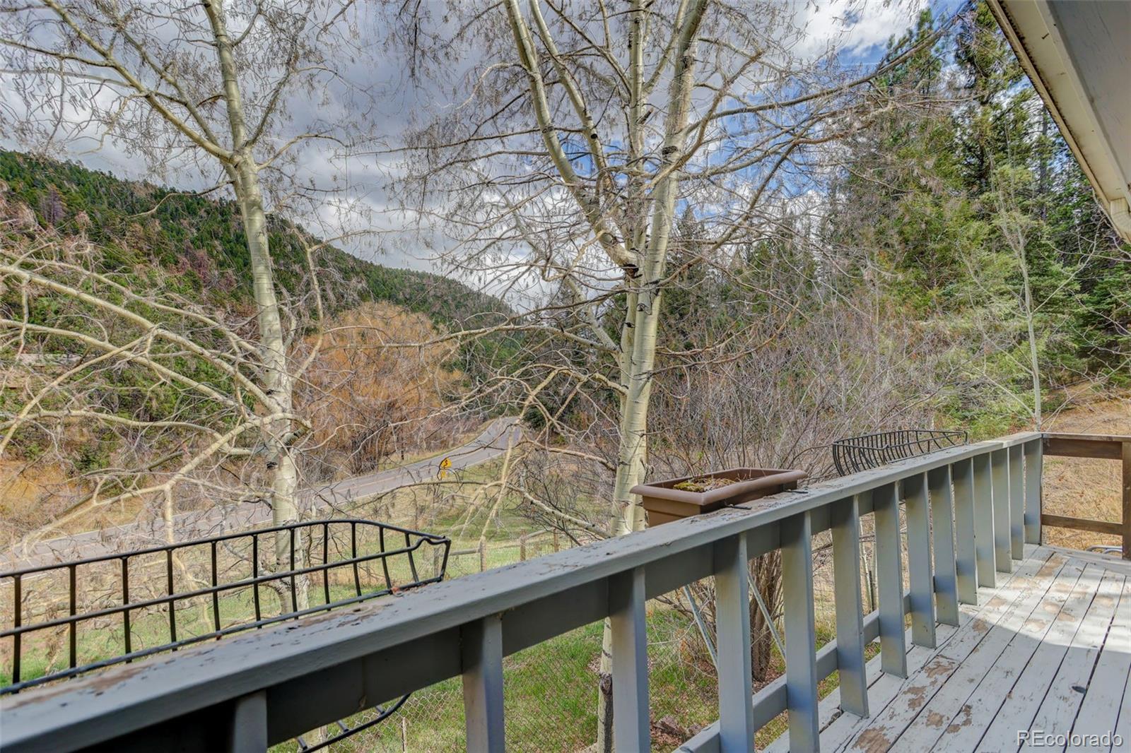 12699 South Foxton Road Conifer, CO 80433 - Photo 31 of 40 a view of balcony with wooden floor and fence