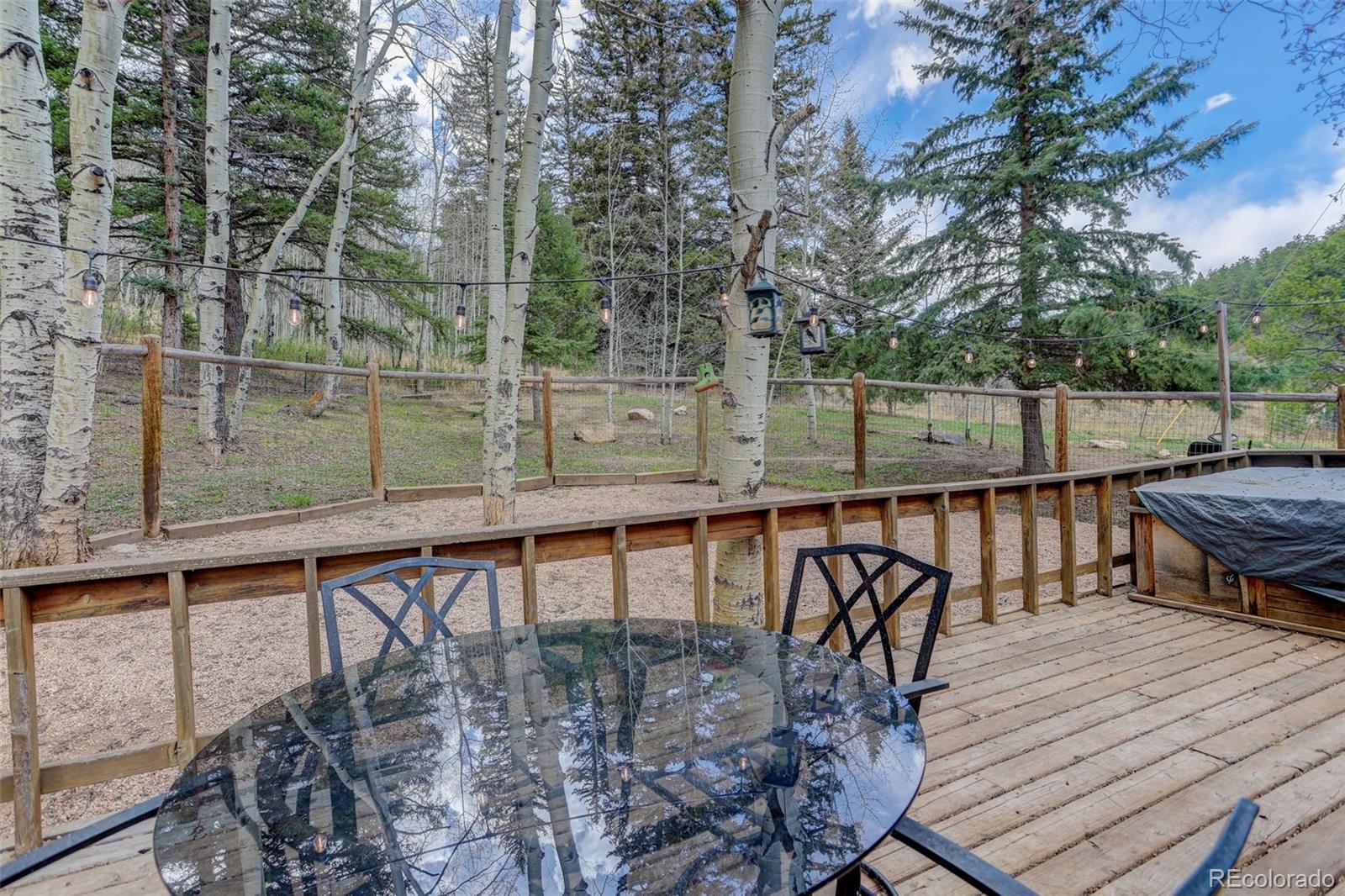 12699 South Foxton Road Conifer, CO 80433 - Photo 32 of 40 a view of balcony with wooden floor and seating space