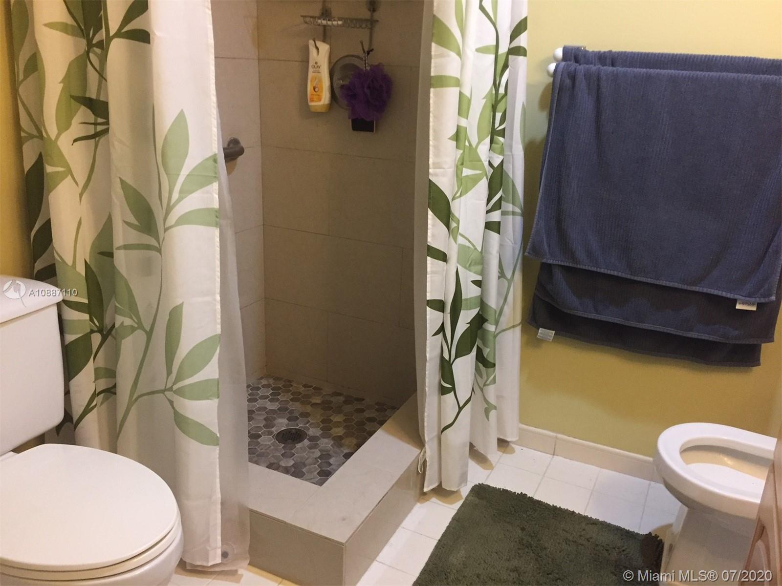 6345 Southwest 138th Court, Unit 110 Miami, FL 33183 - Photo 11 of 13 a bathroom with a toilet and shower