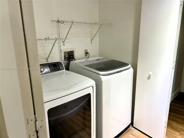 a utility room with dryer and washer