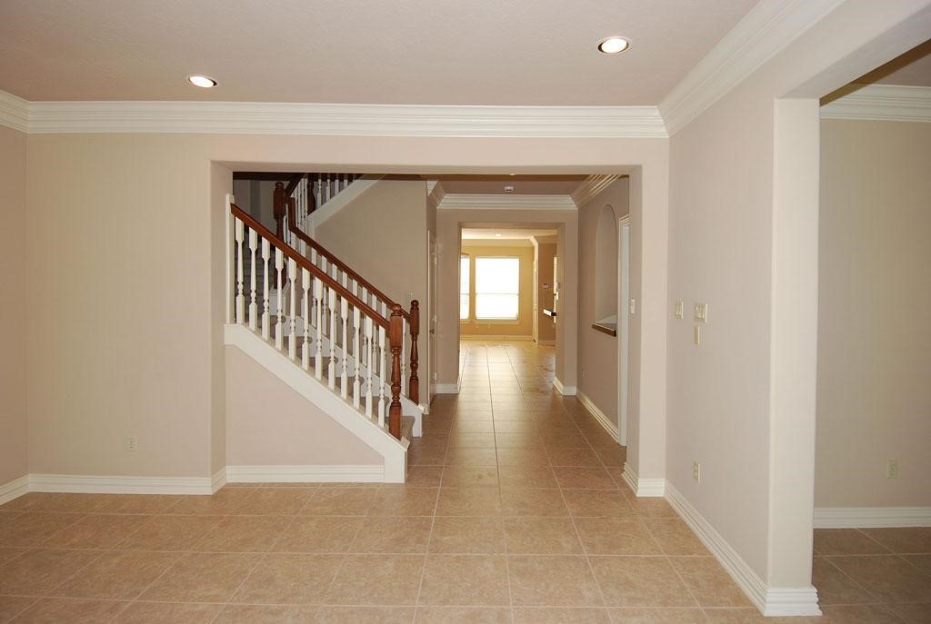 2055 Spring Cedar Lane Houston, TX 77077 - Photo 3 of 26 Gorgeous entryway with view of staircase