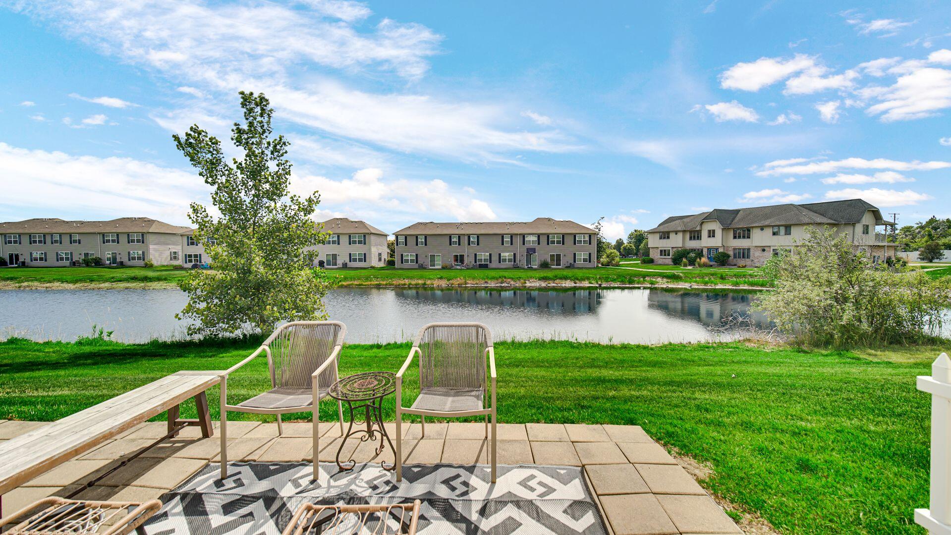 11175 Vermont Circle Crown Point, IN 46307 - Photo 19 of 22 a view of a lake with a garden