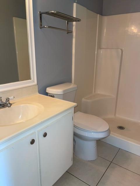 1180 Carlton Court, Unit 204B Fort Pierce, FL 34949 - Photo 14 of 19 a bathroom with a granite countertop sink toilet and shower