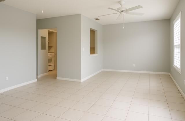 1180 Carlton Court, Unit 204B Fort Pierce, FL 34949 - Photo 6 of 19 an empty room with a ceiling fan and a window