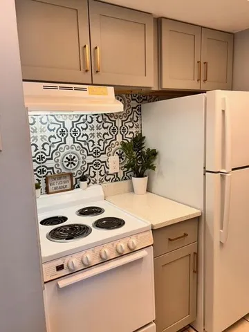a view of a kitchen with appliances and cabinets