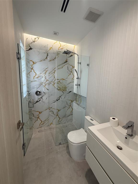 12245 Southwest 29th Terrace Miami, FL 33175 - Photo 15 of 23 a bathroom with a white toilet and a shower