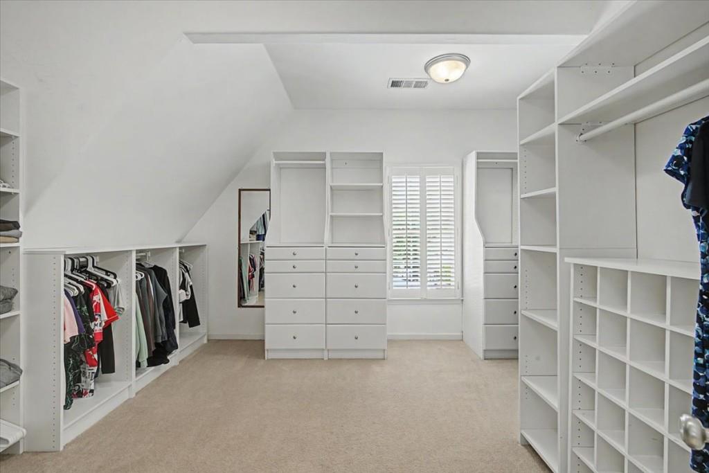 122 Ridge View Drive Ball Ground, GA 30107 - Photo 43 of 84 a view of walk in closet with clothes and shoes