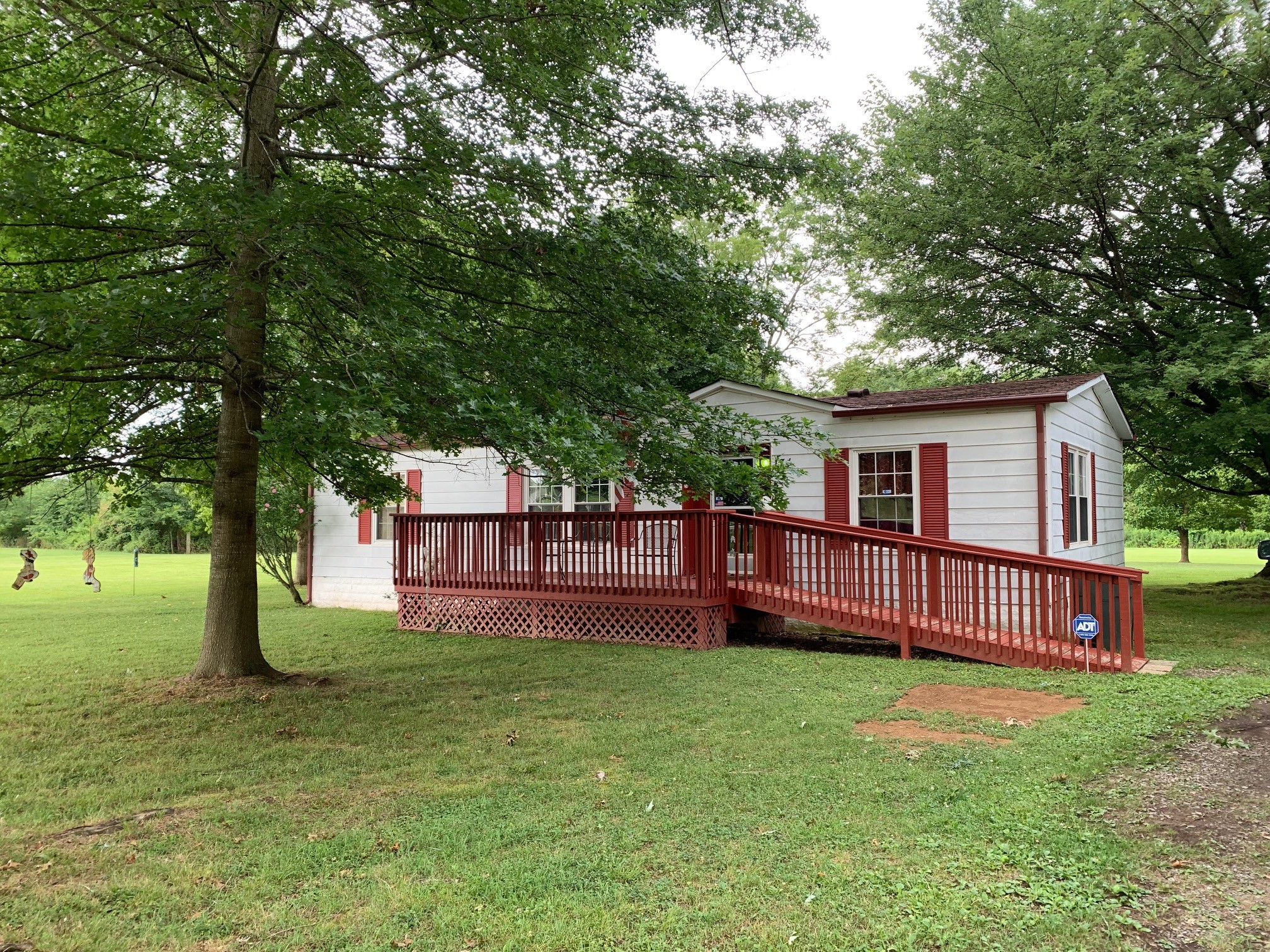 174 T T G T Road Portland, TN 37148 - Photo 2 of 17 a front view of a house with a garden
