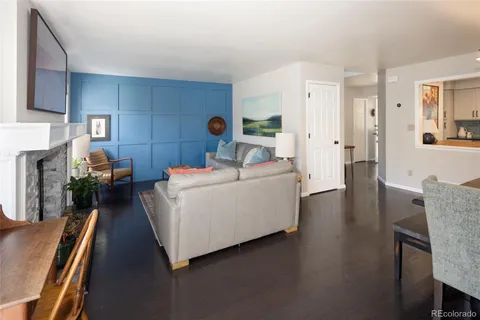 a view of a livingroom with workspace and a couch