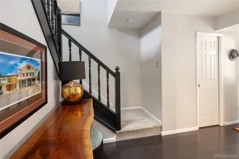 a bedroom with furniture and a flat screen tv