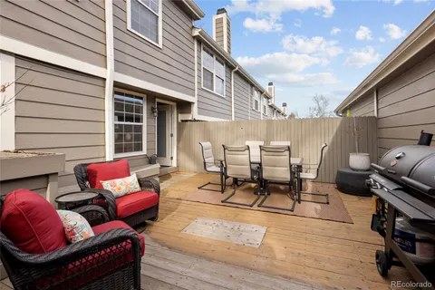 a view of a two chairs in the balcony