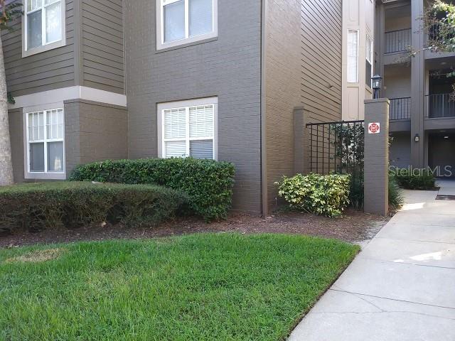 420 Summit Ridge Place, Unit 110 Longwood, FL 32779 - Photo 1 of 1 a view of a house with a garden and plants