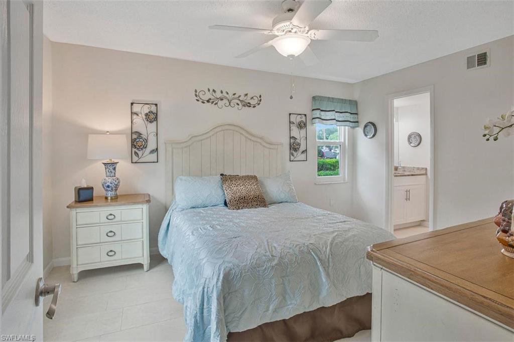 4258 27th Court Southwest, Unit 106 Naples, FL 34116 - Photo 14 of 19 Main suite with rear facing and side facing windows