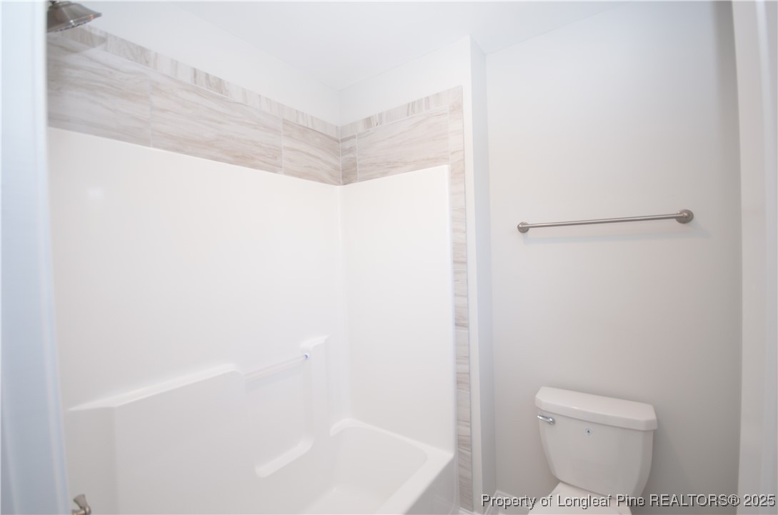 2937 Lemuel Black Road Spring Lake, NC 28390 - Photo 22 of 32 a bathroom with a white toilet and a shower