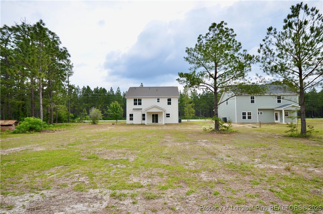 2937 Lemuel Black Road Spring Lake, NC 28390 - Photo 32 of 32 a front view of house with yard and trees in the background