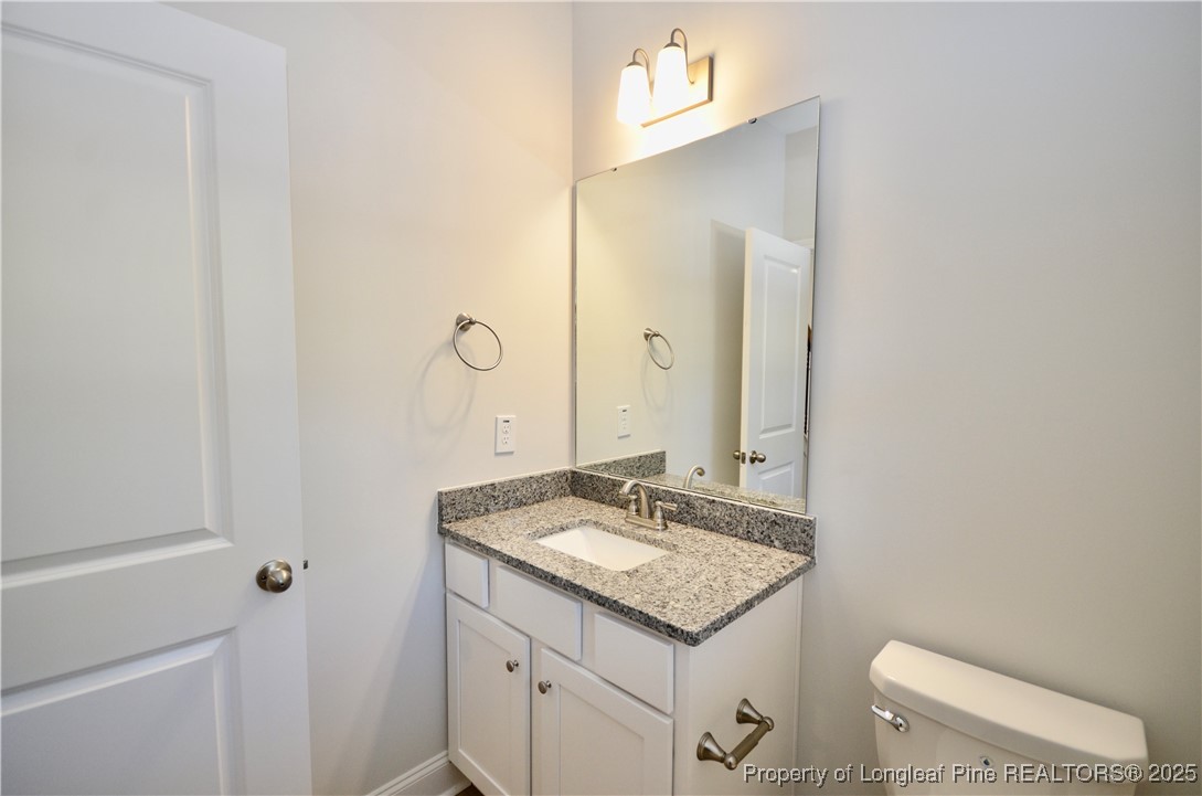 2937 Lemuel Black Road Spring Lake, NC 28390 - Photo 5 of 32 a bathroom with a sink and a mirror
