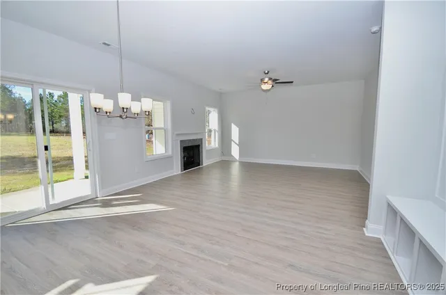 a kitchen with granite countertop a sink a stove and a wooden floors