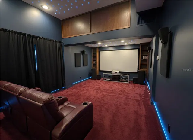a kitchen with sink a stove and cabinets