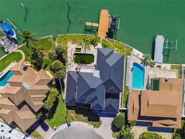 an aerial view of a house with a lake view