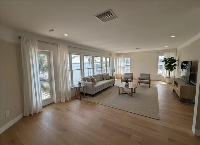 a kitchen with a table and chairs under an umbrella