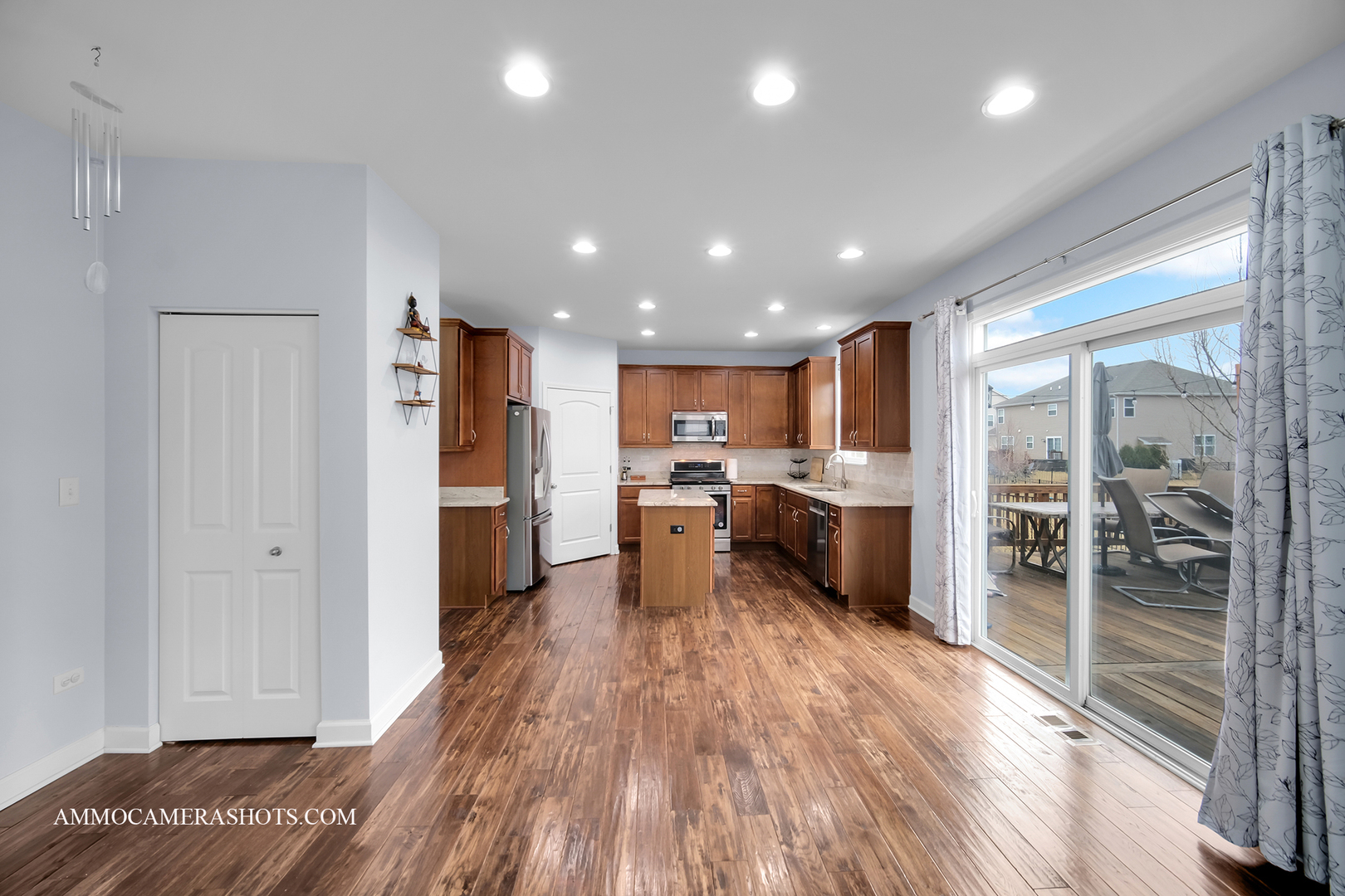 2305 Brookstone Drive Bolingbrook, IL 60490 - Photo 7 of 33 a kitchen with a refrigerator and wooden floor