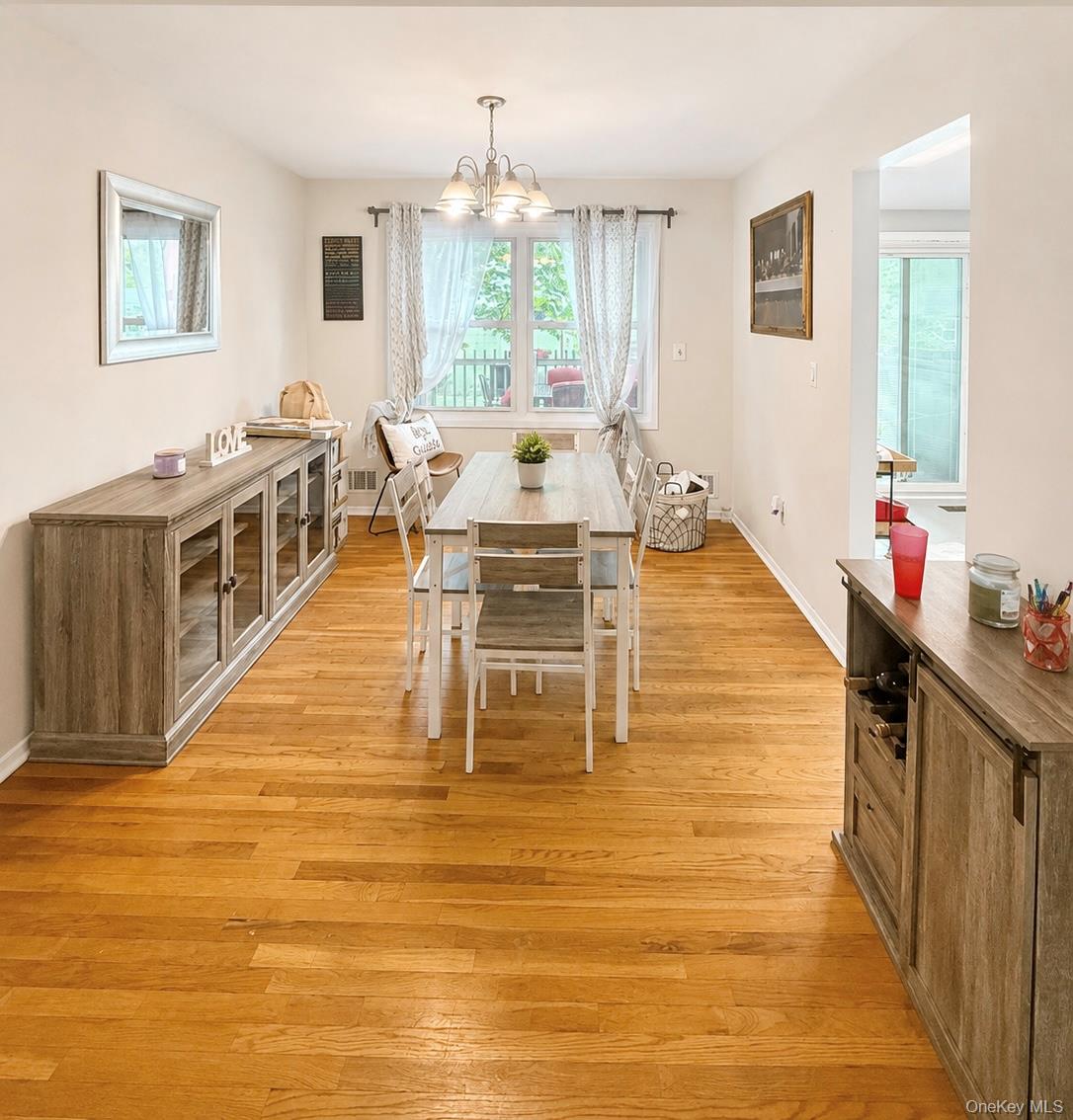 25 Rosman Road Thiells, NY 10984 - Photo 6 of 11 a living room with furniture a large window and kitchen view