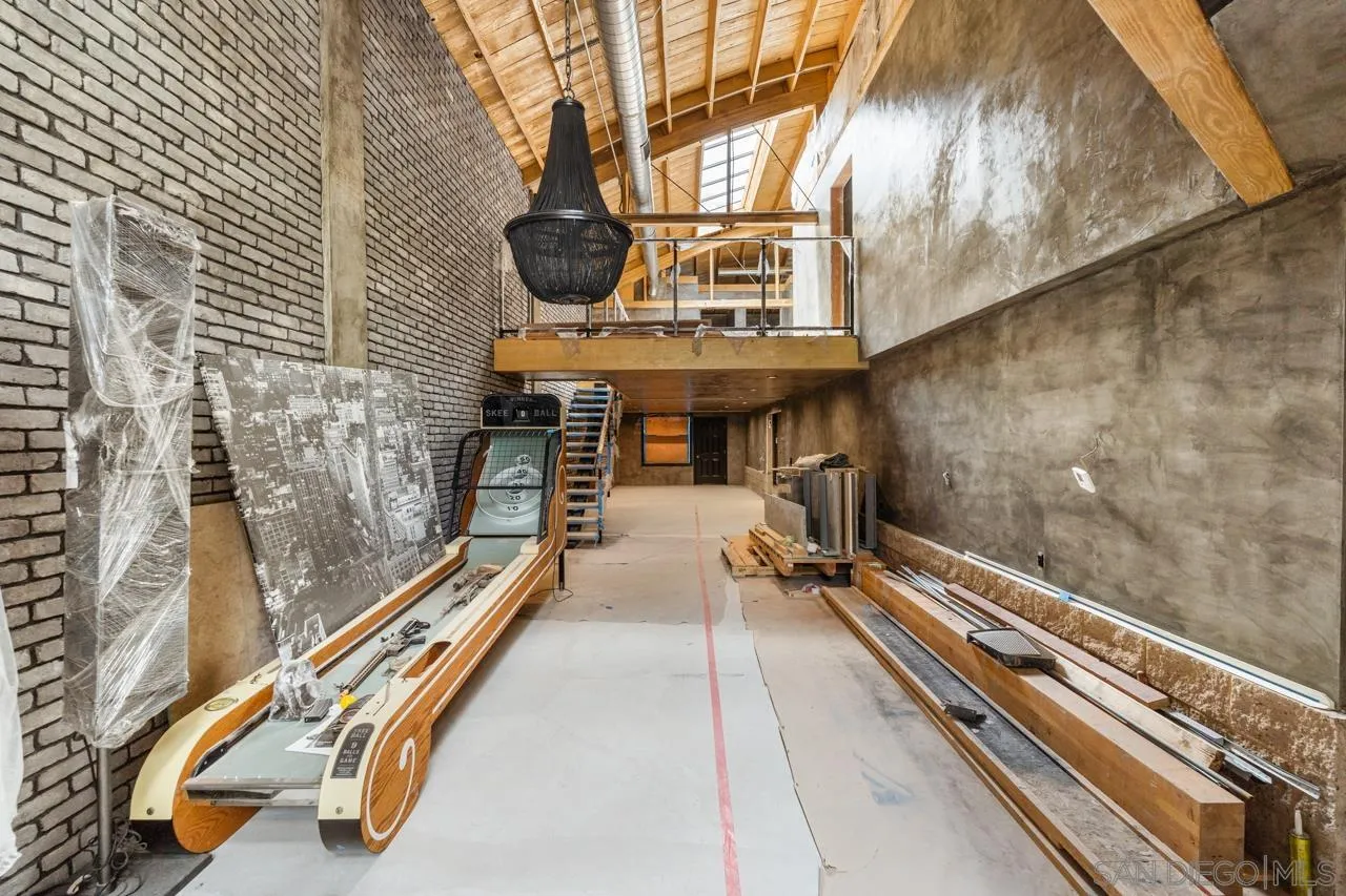 843 Tenth Avenue, Unit A & B San Diego, CA 92101 - Photo 32 of 75 a view of a balcony with chairs and iron stairs