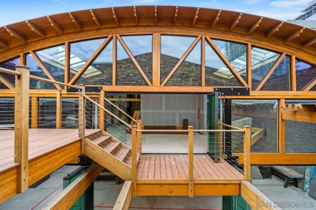 a view of roof deck with patio