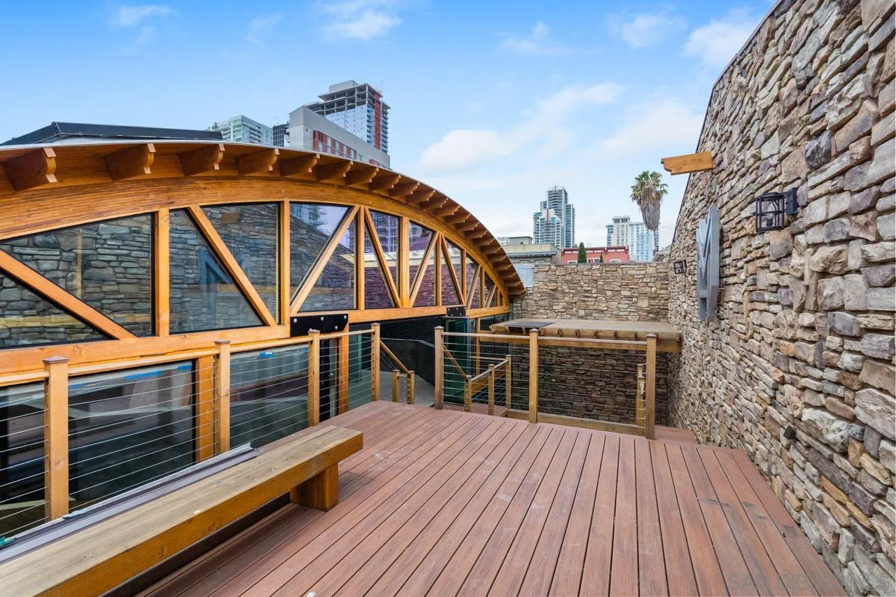 843 Tenth Avenue, Unit A & B San Diego, CA 92101 - Photo 60 of 75 a roof deck with a table and a barbeque