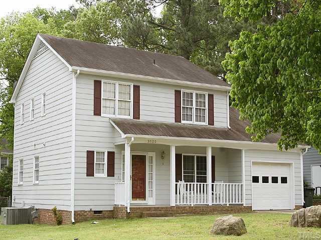 3720 Dusty Lane Raleigh, NC 27604 - Photo 11 of 11 a view of a white house with a big yard and large trees