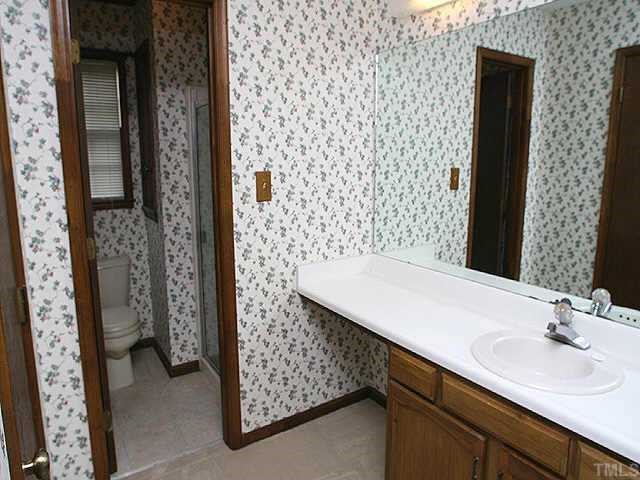 3720 Dusty Lane Raleigh, NC 27604 - Photo 8 of 11 a bathroom with a sink and a mirror