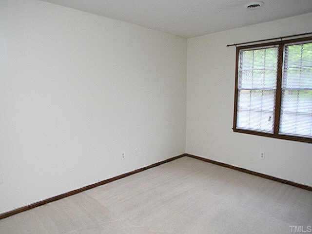 3720 Dusty Lane Raleigh, NC 27604 - Photo 9 of 11 an empty room with a window