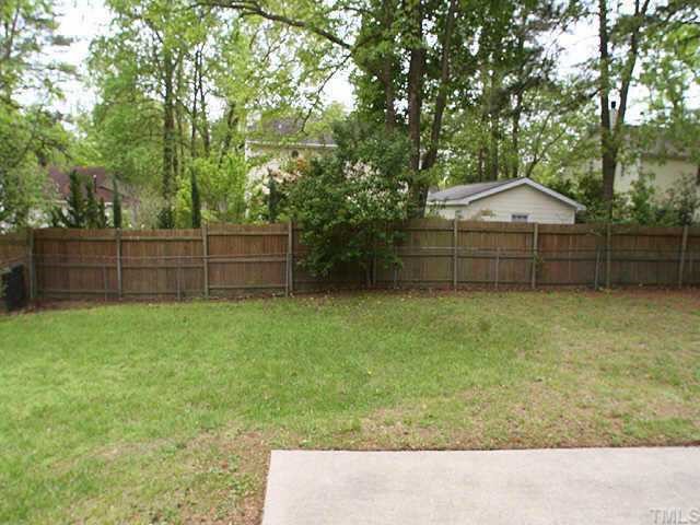 3720 Dusty Lane Raleigh, NC 27604 - Photo 10 of 11 a backyard of a house with lots of green space