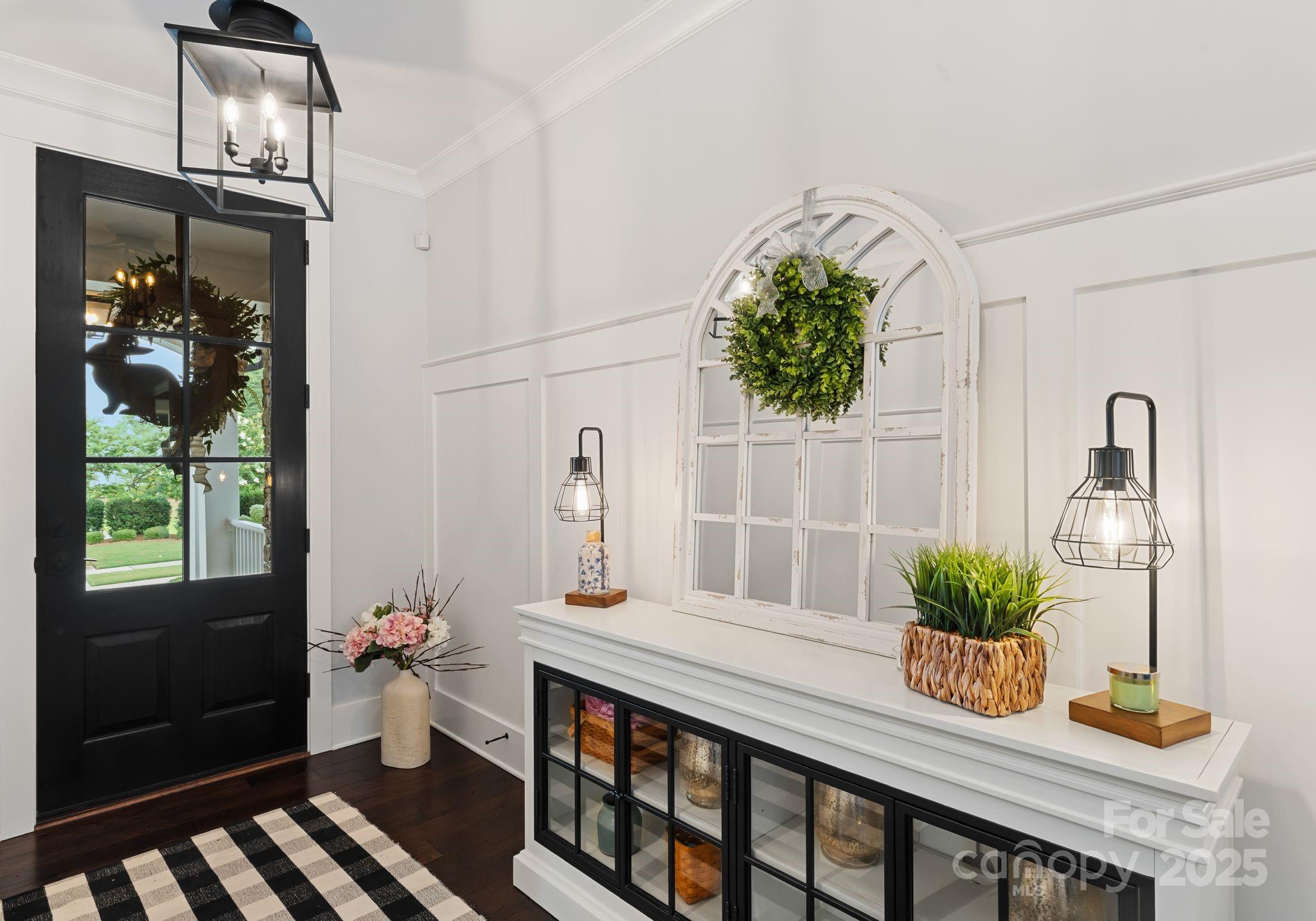 9043 Golden Rock Lane Huntersville, NC 28078 - Photo 13 of 48 a dining room with furniture potted plants and wooden floor