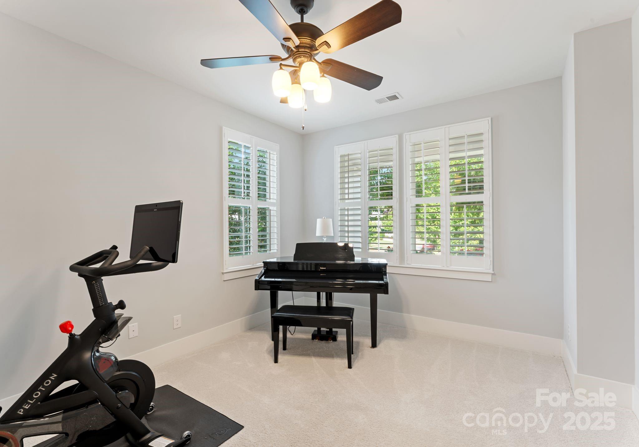 9043 Golden Rock Lane Huntersville, NC 28078 - Photo 14 of 48 a view of a workspace with furniture and a window
