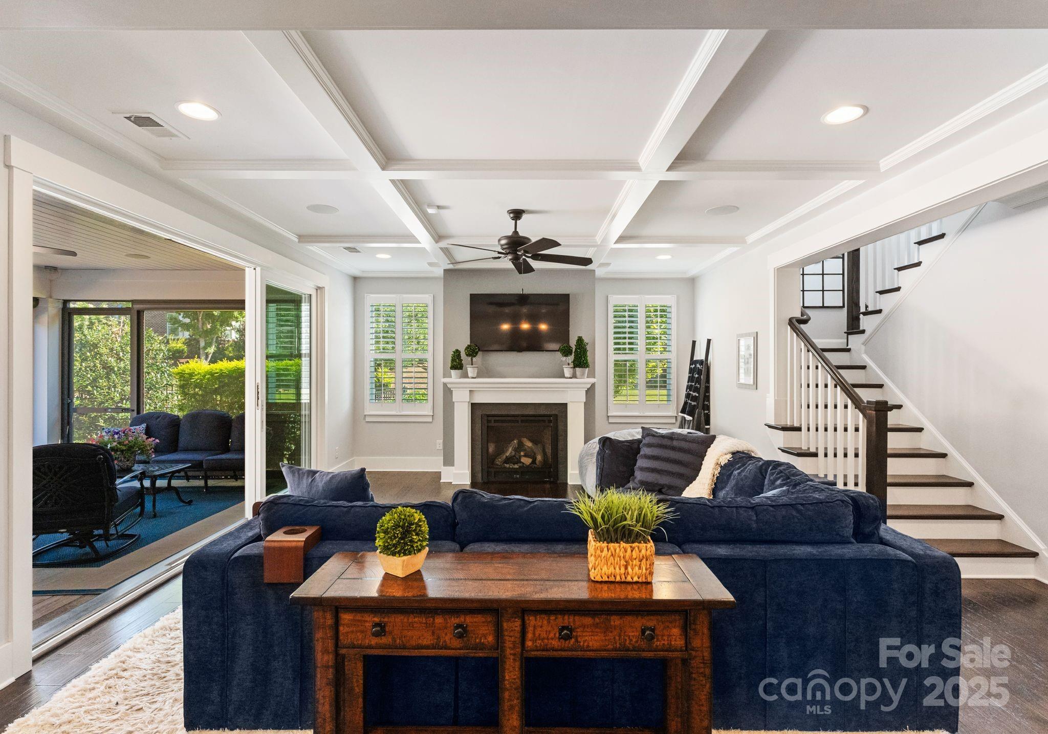 9043 Golden Rock Lane Huntersville, NC 28078 - Photo 19 of 48 a living room with furniture and a fireplace