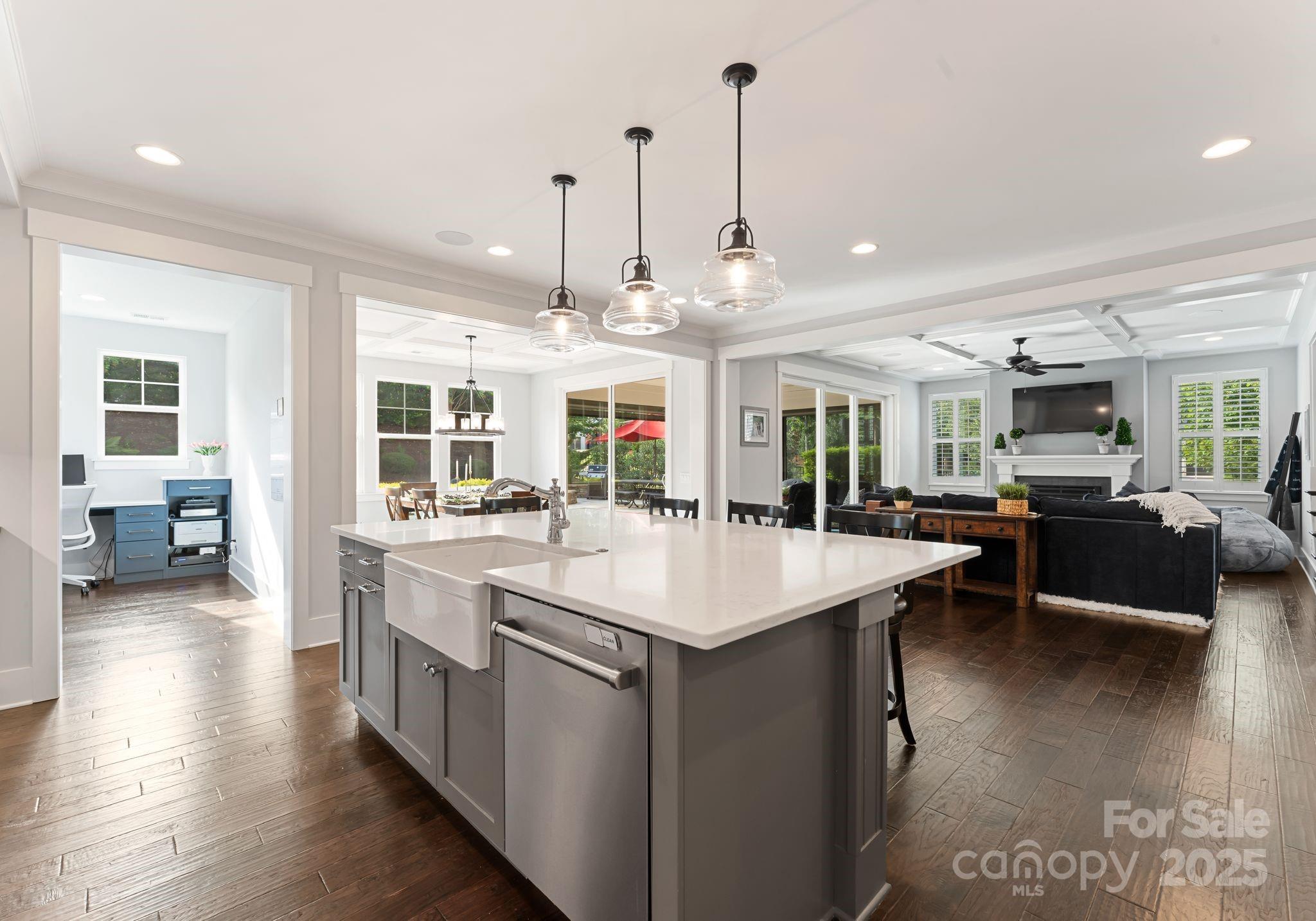 9043 Golden Rock Lane Huntersville, NC 28078 - Photo 23 of 48 a large kitchen with kitchen island a sink table and chairs