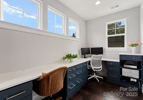 a bathroom with a window and shower