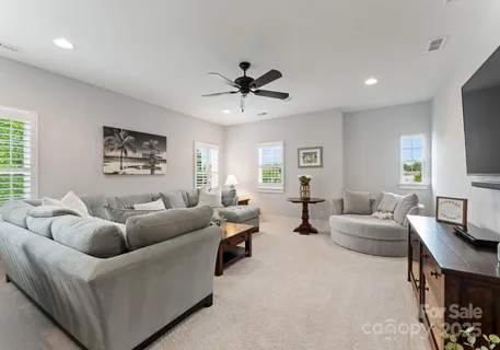 a bedroom with a large bed and a large window