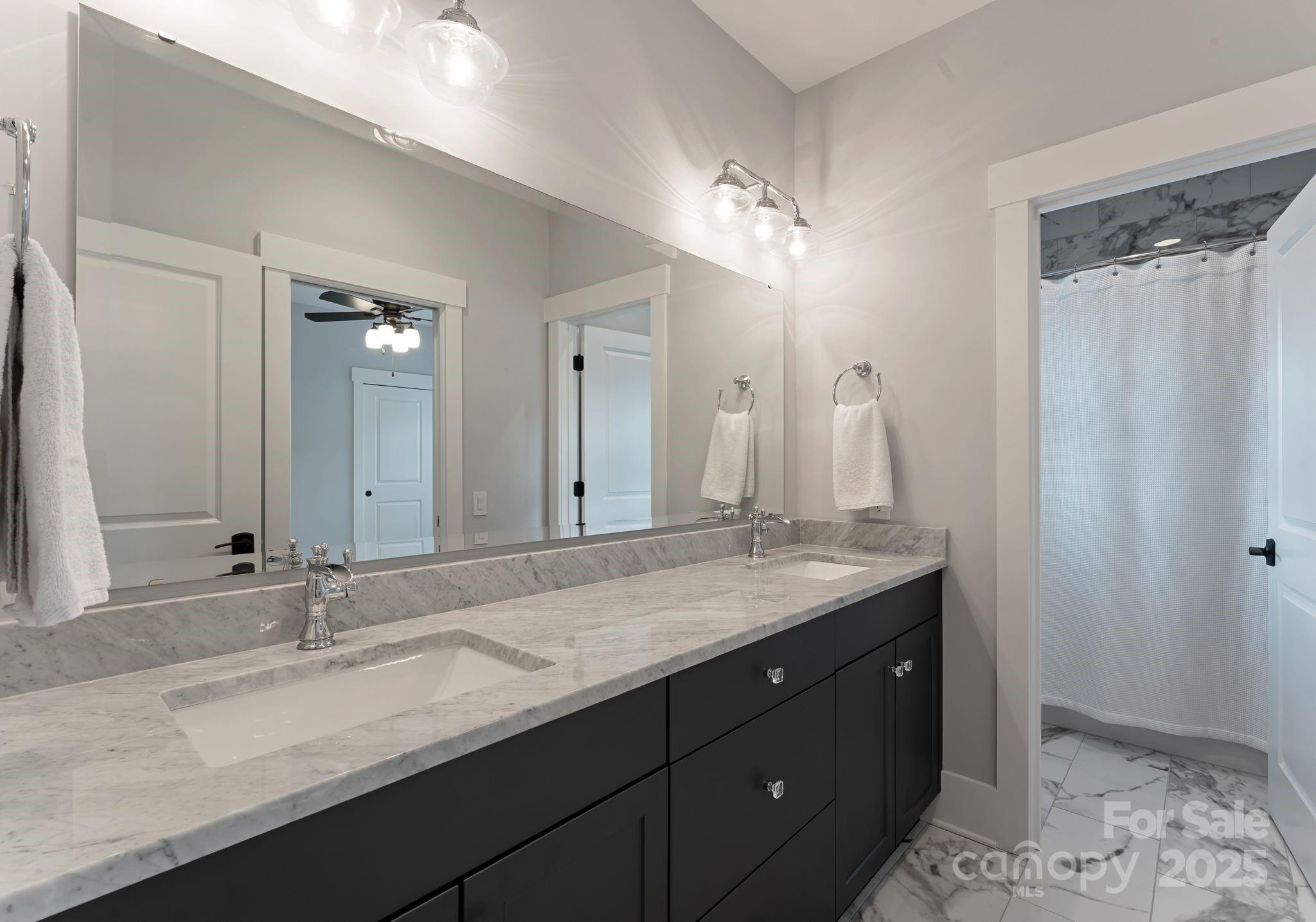 9043 Golden Rock Lane Huntersville, NC 28078 - Photo 39 of 48 a bathroom with a granite countertop sink and a mirror