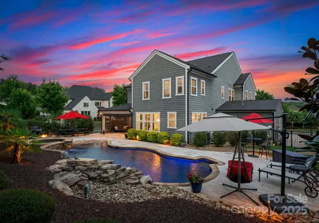 a front view of house with yard and outdoor seating